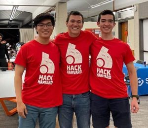 HackHarvard 2022 co-directors Edward Kang and Nathan Li, left and right, and former director Cameron Akker, middle, after the opening ceremonies. (Sophia Wang)